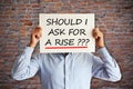 Salary increase or negotiation concept with employee asking Ã¢â¬Åshould I ask for a riseÃ¢â¬Â